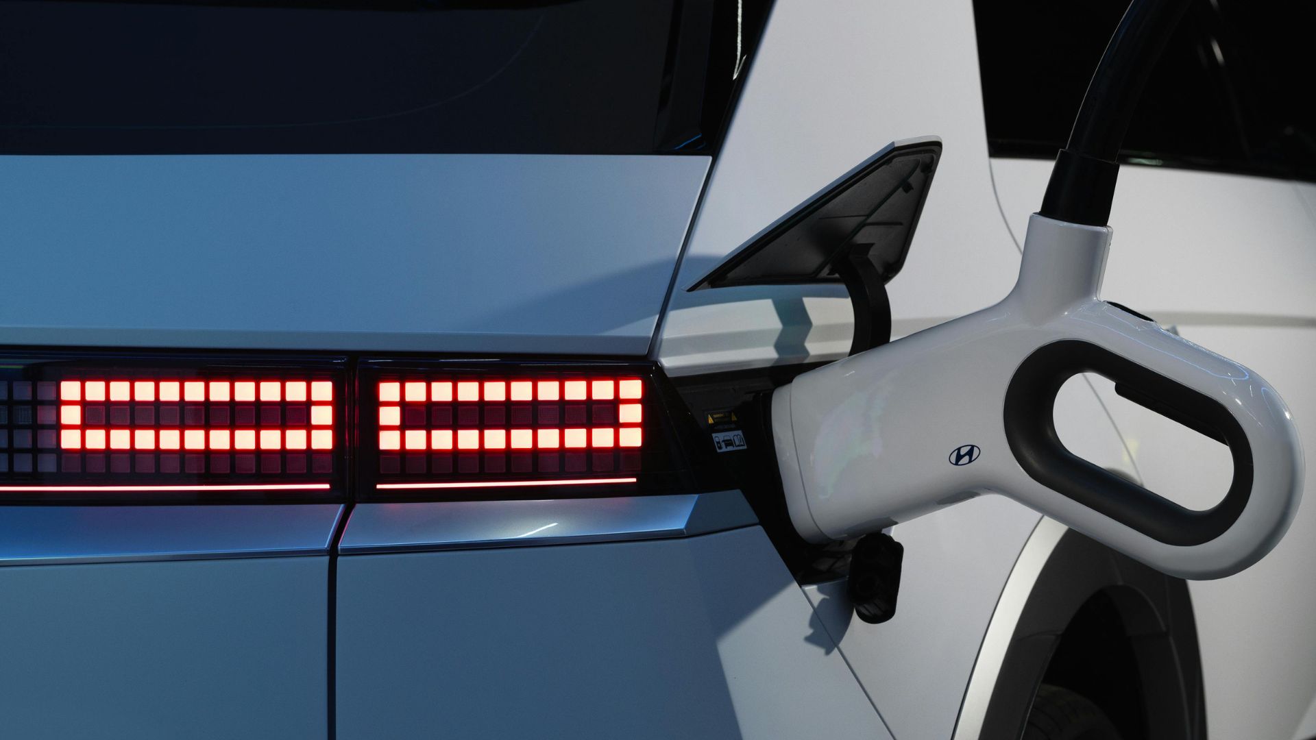 Hyundai electric vehicle charging with red LED taillight detail